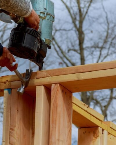Framing building contractor framing using nail gun Scaffolding Rental NYC